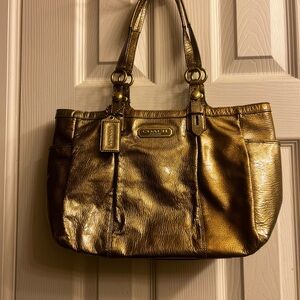 Coach Gold Satchel with Metallic Finish and Elegant Hardware